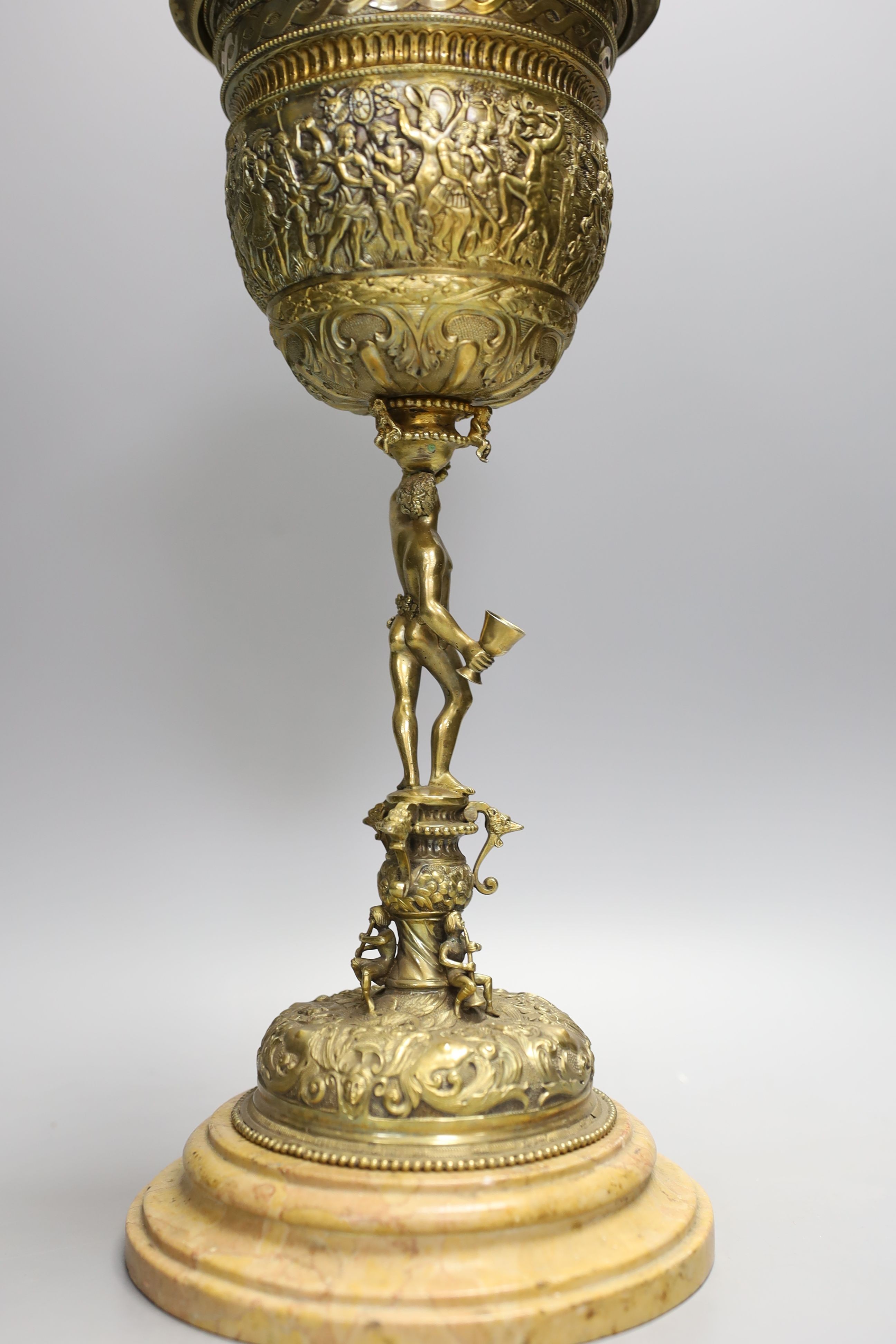 A decorative Bacchus electrotype chalice and cover on stone base - 49cm high